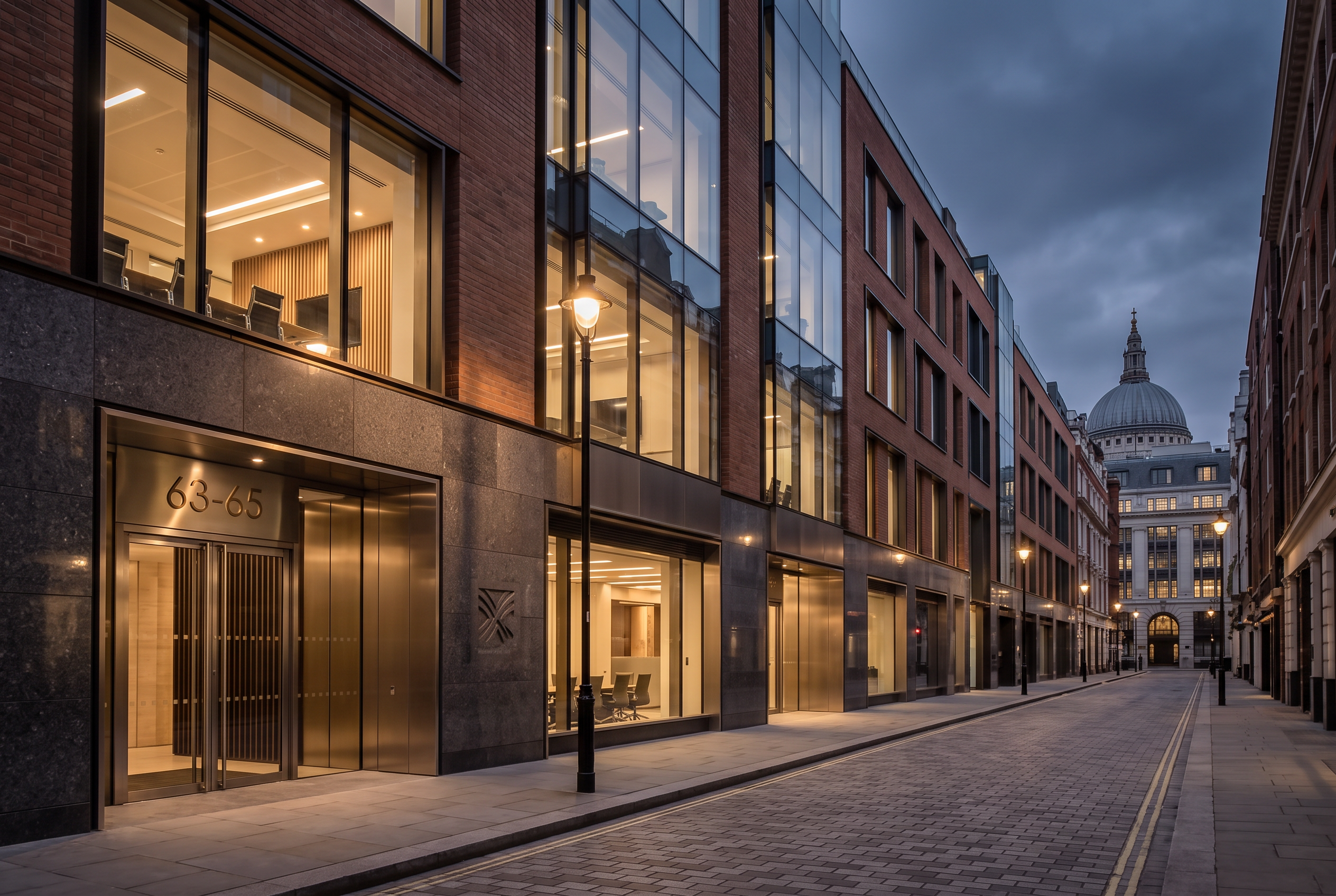 London business street at dusk with lit shopfronts